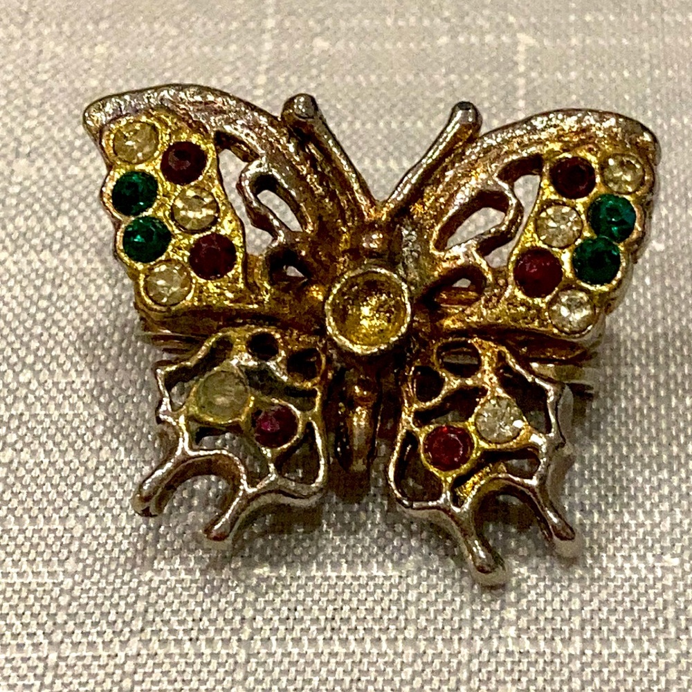 5/$25 Butterfly sawtooth clip. Colored rhinestones
